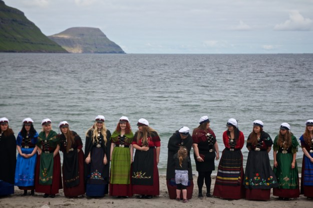 Graduates of the Studentaskúlin (junior college) in Eysturoy gather on the beach in Gøtu as part of their graduation ceremony. This year's graduating class was more than two-thirds female.